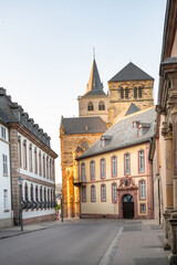 Fototapeta premium Road to High Cathedral of Saint Peter in Trier, Moselle Valley Germany, roman catholic dom, brickwork tower facade 