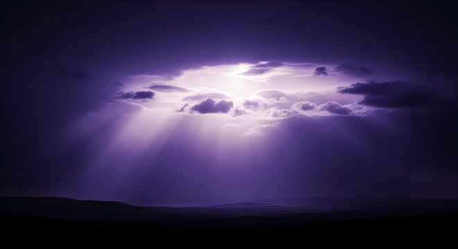 Dramatic purple storm clouds with radiant sunbeams breaking through over a dark landscape horizon