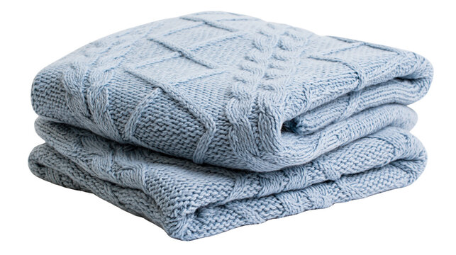 Soft blue knitted blanket with cable knit pattern, folded neatly isolated on transparent background