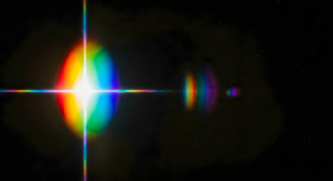 Dramatic lens flare effect with vibrant rainbow colors against a dark starry night sky cinematic lighting