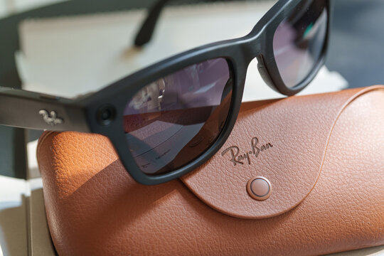 Dusseldorf, Germany - July 9 2026: Ray-Ban Meta Wayfarer smart glasses resting on the official protective carrying case