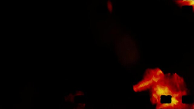 Film Strip with Glowing Light Orbs and Fiery Background