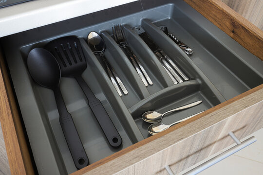 Kitchen drawer filled with cutlery organizer