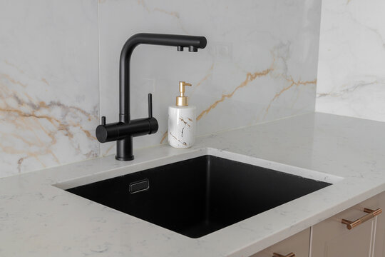Kitchen interior with black faucet
