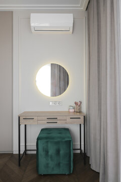 Modern dressing table with round mirror