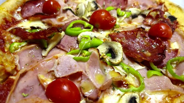 Freshly Baked Pizza With Salami Ham Mushrooms Cherry Tomatoes Green Bell Pepper Melted Cheese. Italian Fast Food 