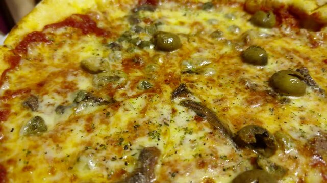 Italian Pizza With Green Olives Anchovies Capers And Melted Cheese. Freshly Baked Mediterranean Pizza 