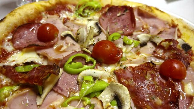 Italian Pizza With Salami Ham Mushrooms Green Pepper And Cherry Tomatoes. Freshly Baked Savory Pizza 