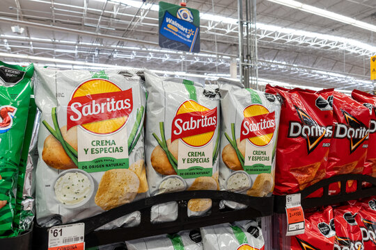Bags of Sabritas Sour Cream and Spices potato chips, by PepsiCo, on supermarket shelves. Jalisco, Mexico, July 20, 2026. Lays