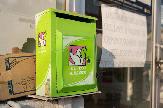 Green mailbox of Correos de Mexico with its logo featuring a flying dove holding a letter. Jalisco, Mexico, July 20, 2026. Servicio Postal Mexicano - SEPOMEX
