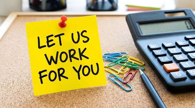 Let Us Work For You text on yellow sticky note, business outsourcing and professional services concept, office desk with calculator and stationery