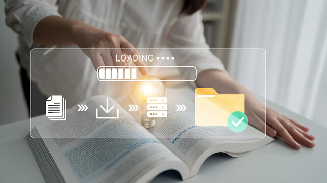 Conceptual image of a woman engaging with an open book while using technology to symbolize knowledge acquisition, data processing, and idea generation in a modern environment. Glyphic.