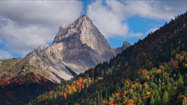 Mountain peak (Tete de Vacheres) and forest of Devoluy Massif in Vercors Park, French Alps. Aerial autumn view in La Jarjatte Valley, Drome, France