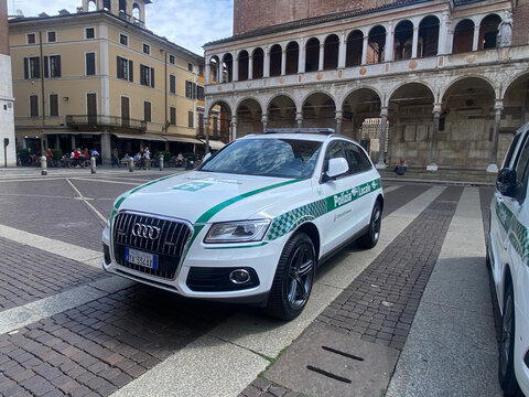White Audi Q5 Polizia Locale SUV parked on Piazza del Comune, Cremona, Italy, ensuring public order and urban safety