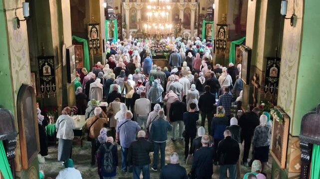 The photo taken from above shows a crowd of Orthodox Christians gathered at the Holy Trinity Cathedral in Dnipro, Ukraine, for a church service during the celebration of Trinity Sunday (Pentecost) on 