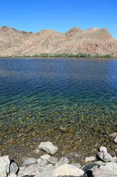 Rocky shore of Colorado River vertical, Arizona