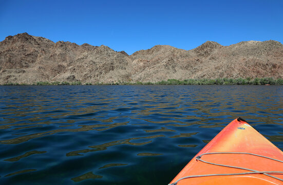 Orange kayak on Colorado River, Arizona