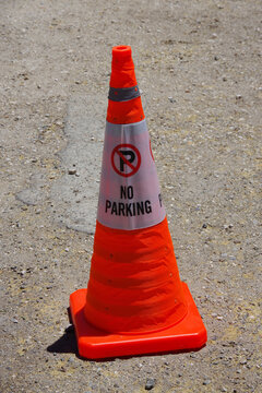 Temporary NO PARKING sign on a traffic cone