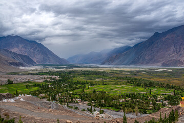 Fototapeta premium Panoramic view of green fields and villages in Nubra Valley, Ladakh