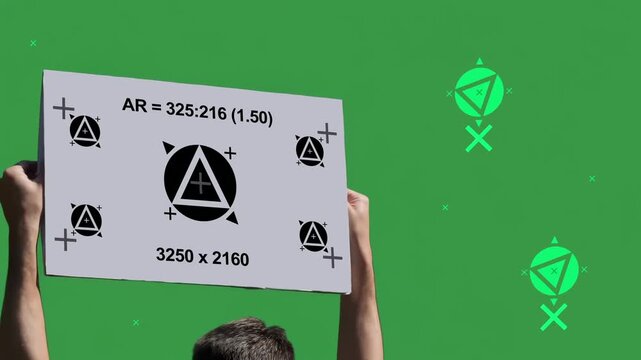 Rear view of person holding a motion-tracked protest sign over a green screen with background tracking markers for seamless replacement and VFX compositing. 15232  