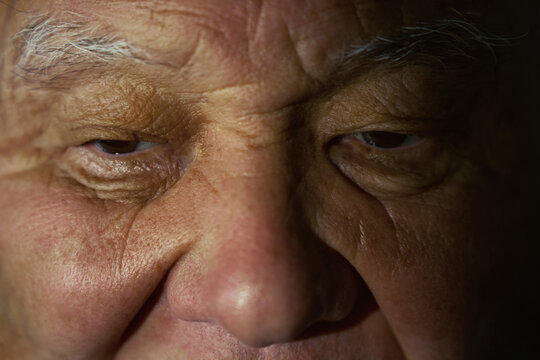 Close-up of an elderly man's face showing deep details
