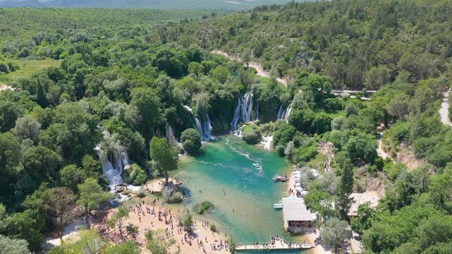 Kravica Waterfall, Bosnia and Herzegovina - June 7, 2026: Aerial panorama of visitors enjoying the famous Kravica Waterfall during summer