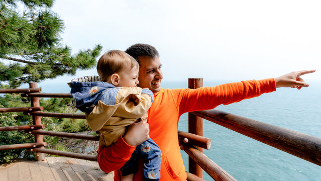 Father and child enjoying view on Igidae Coastal Trail