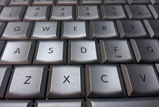 Closeup of silver computer keyboard keys in macro view
