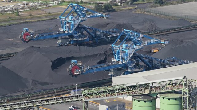 Industrial Reclaimers Manage Coal Piles at a Massive Storage Yard