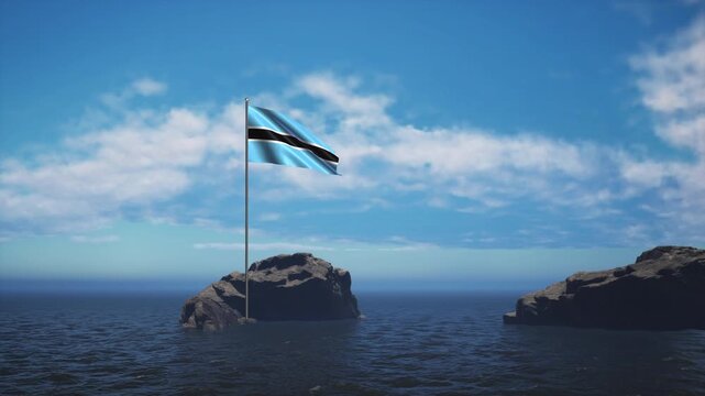 Botswana Flag Standing In The Middle Of The Ocean Near A Rock