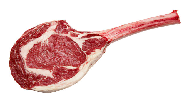 Raw tomahawk steak with thick bone marbled red meat, isolated on transparent background