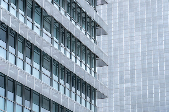 Modern glass office facade with geometric grid pattern