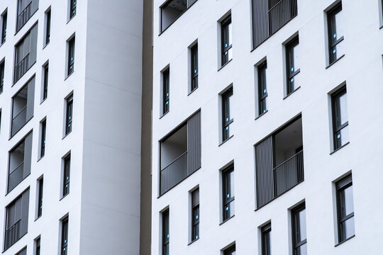 Modern apartment facade with windows and balconies pattern