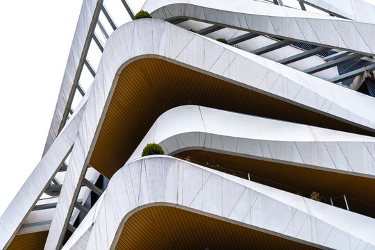 Modern curved building facade with layered terraces