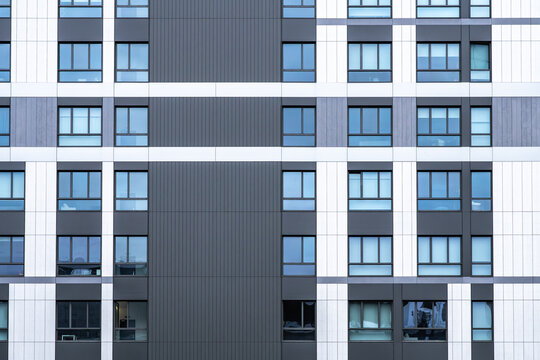 Modern apartment facade with geometric window pattern