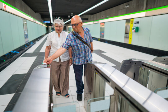 Seniors navigating metro ticket barriers