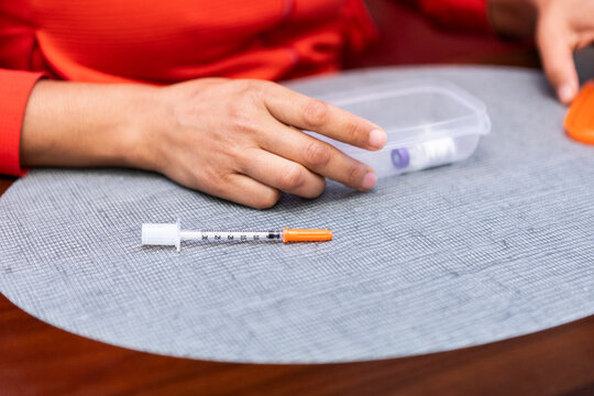 Insulin syringe with pet medicine on a table