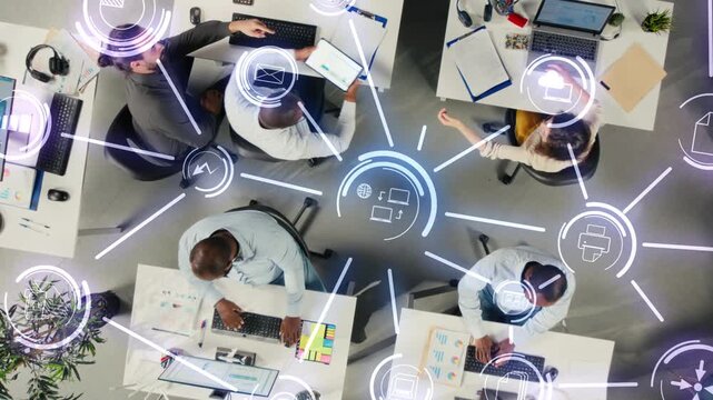Business colleagues share project files through cloud integration in a company office, syncing documents on an online network with HUD data icons and remote server access.