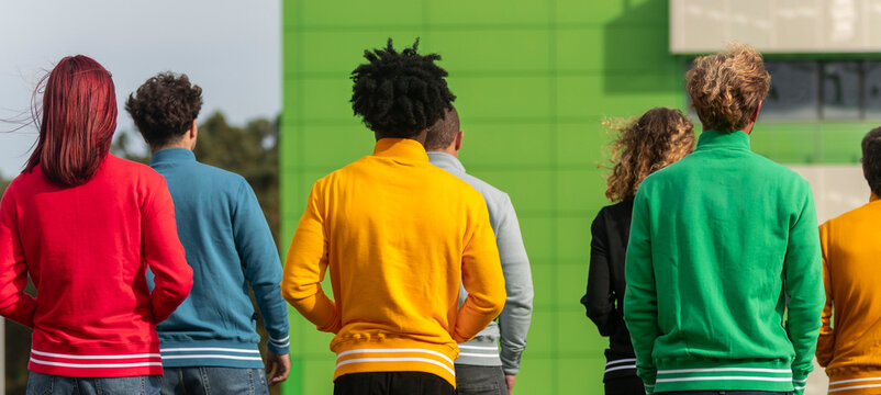Group of people in colorful sweatshirts outdoors