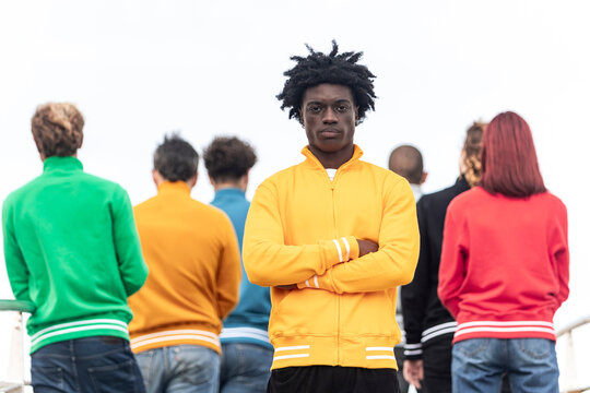 Diverse group in colorful sweatshirts facing forward