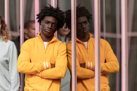 Young man in vibrant yellow full zip sweatshirt