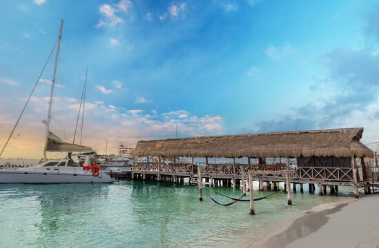 Serene Isla Mujeres beach pier and emerald water in Cancun