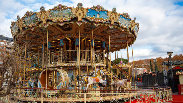 Vintage carousel at Christmas market in winter town square
