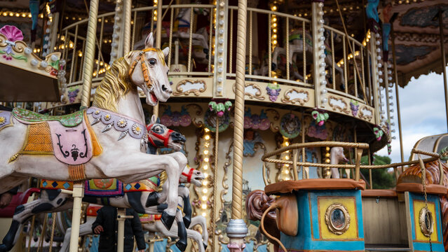 Vintage carousel at Christmas market with festive lights