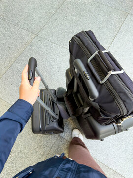 Traveler with luggage on journey captured from above