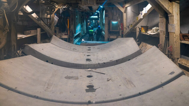 Curved concrete panel installation in tunnel construction site