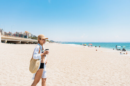 Mature woman enjoying a sunny day at the beach