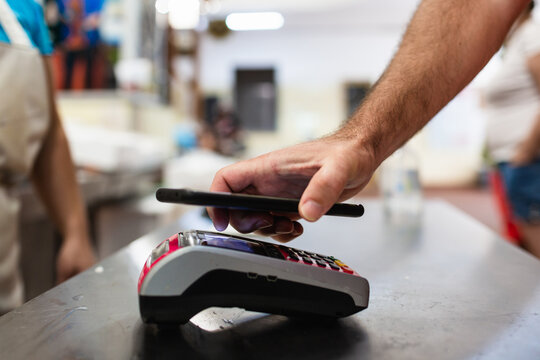 Mobile payment at a fish market in Lisbon