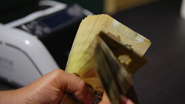 Managing canadian dollars with careful hands in business settings