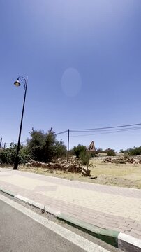 Aguerd, Tafraout, Morocco &ndash; May 31, 2026: A scenic view of the famous Napoleon's Hat rock formation rising above the entrance to Aguerd village in the heart of the Anti-Atlas Mountains.
